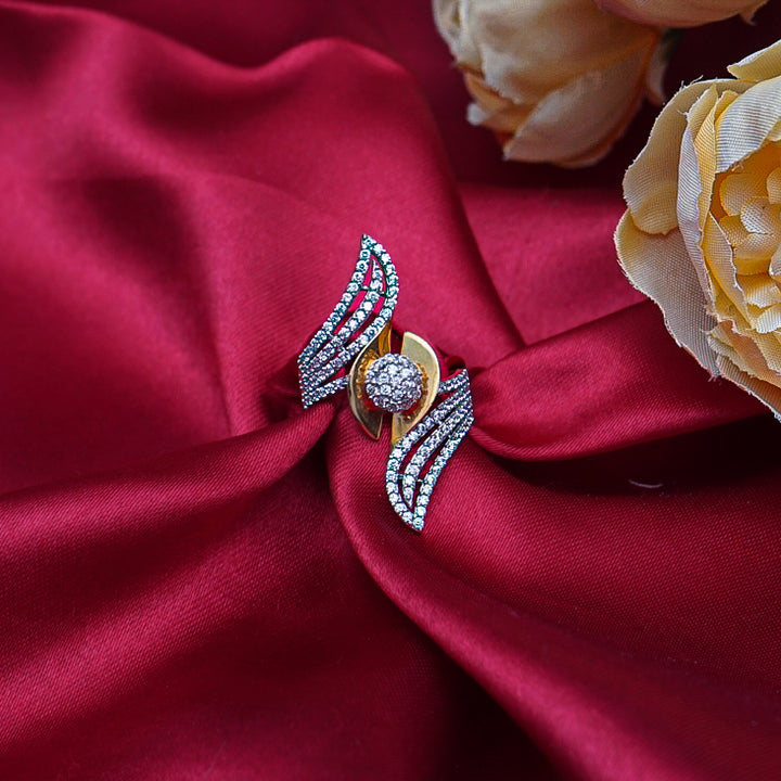 "A simple yet luxurious gold ring, featuring brilliant diamonds that capture light and attention effortlessly."