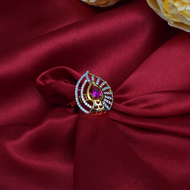 "An exquisite petal-shaped gold ring with a vibrant red gemstone at its center.