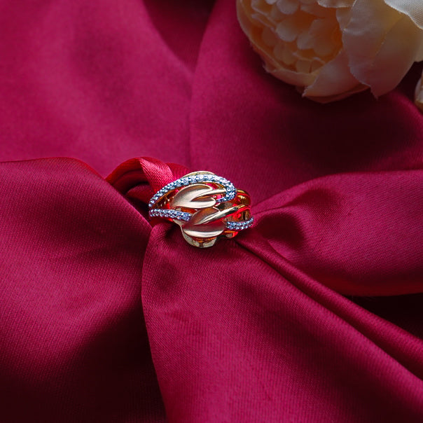 "An exquisite gold ring adorned with intricate petal designs with shimmering diamonds.