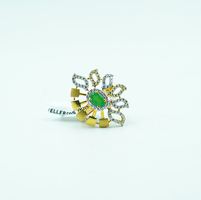 "A luxurious gold ring with a vibrant green gemstone and diamond accents".