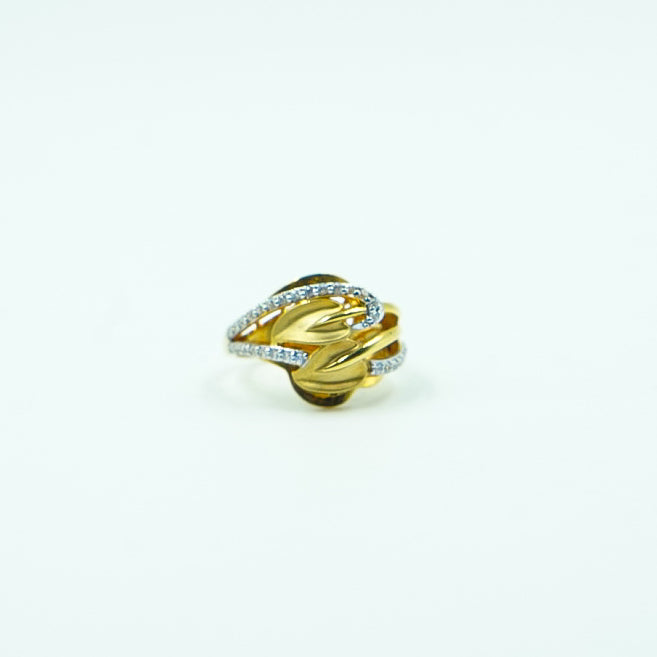 "An exquisite gold ring adorned with intricate petal designs with shimmering diamonds.