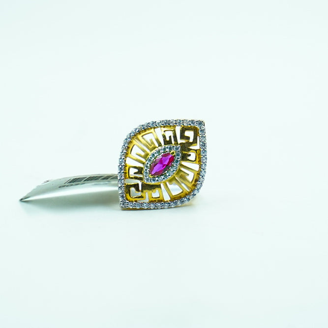 Elegant gold ring features a fiery red gemstone, beautifully framed by shimmering diamonds.