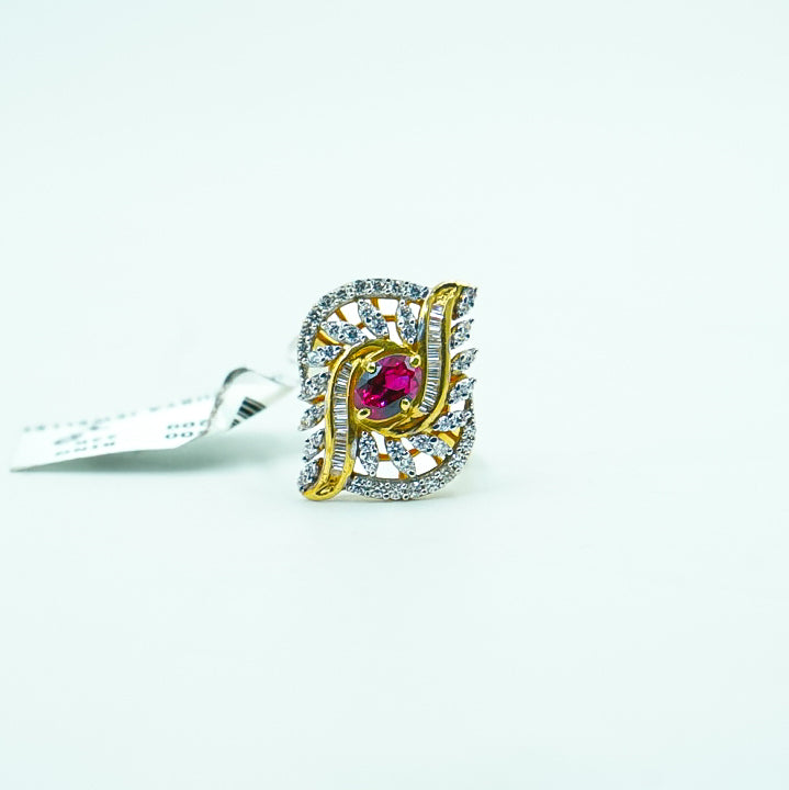 "A striking gold ring with brilliant diamonds surrounding a bold red gemstone at its heart.
