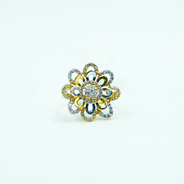 "A stunning round flower-shaped gold ring, with intricate petals that radiate outward, each adorned with sparkling dimonds.